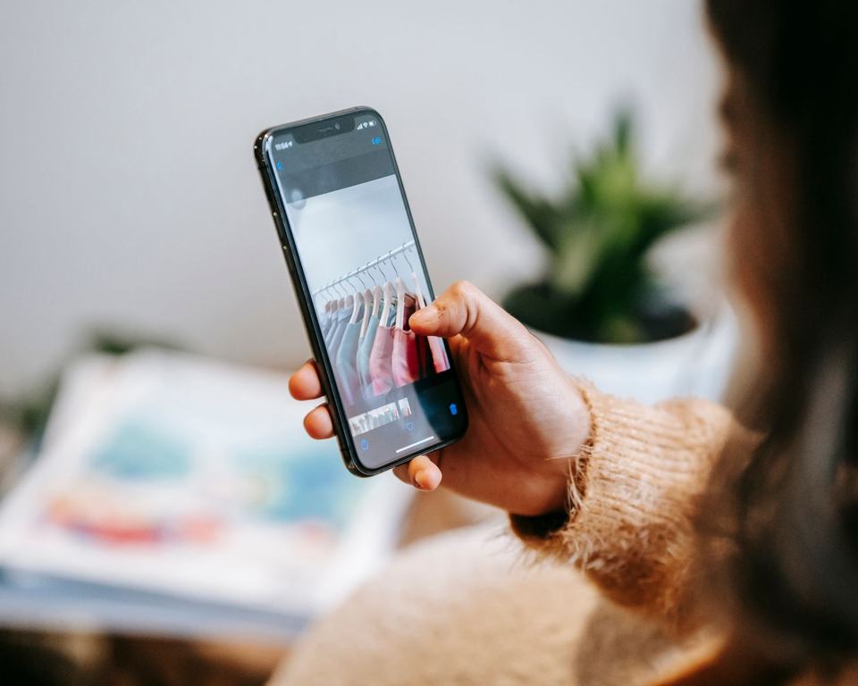 A person asking a question on their phone at home